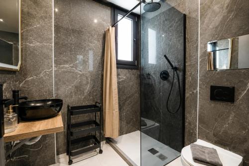 a bathroom with a shower and a sink at GLP Sivota in Syvota