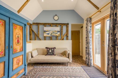 a living room with a couch and a window at 6 Bed in Ardleigh oc-b35089 in Ardleigh