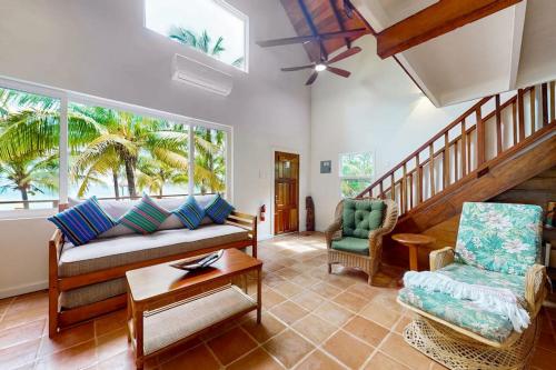 a living room with a couch and two chairs at Ocean Edge Gold Standard Certified in Maya Beach