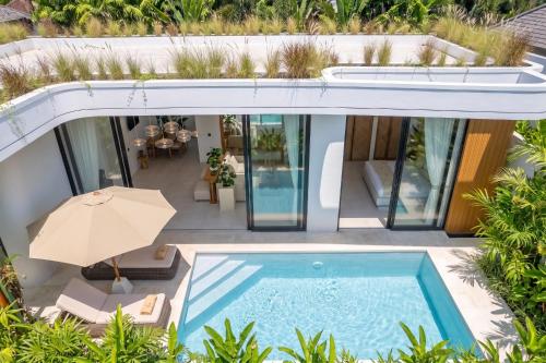 an aerial view of a house with a swimming pool at Ardhana Villas - Luxury Pool Stay with Scenic Views in Ungasan