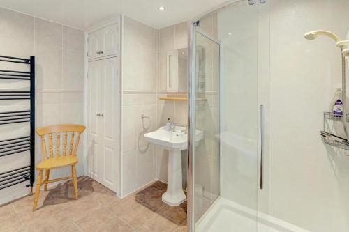a bathroom with a shower and a sink at 3 Bed in Bassenthwaite oc-lr197 in Bassenthwaite