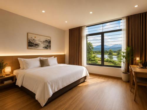 a bedroom with a large bed and a large window at Solwind Riverside in Danang