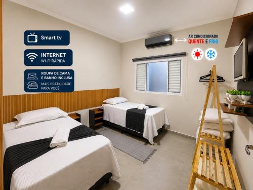 a hospital room with two beds and a sign at Casa Lago da Dinda 3 in Espirito Santo Do Pinhal