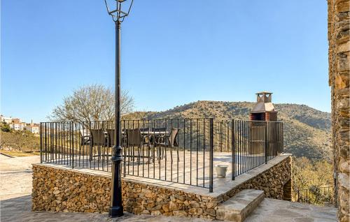 a street light in front of a gate with a table at Yerbaluisa in Laroya