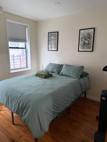 a large bed in a bedroom with a window at Madison - Shared apartment in New York