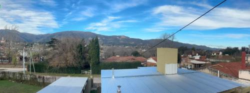 a view of a town with mountains in the background at aura in La Falda