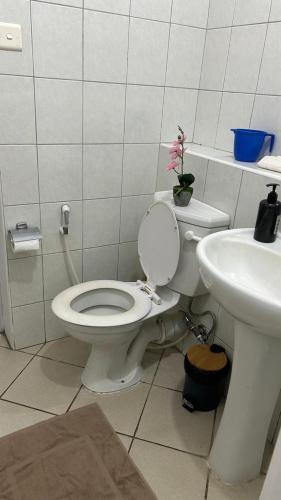 a bathroom with a toilet and a sink at RESIDENCE CYBERVILLAGE THREE ROOMS Apartment in Ebene