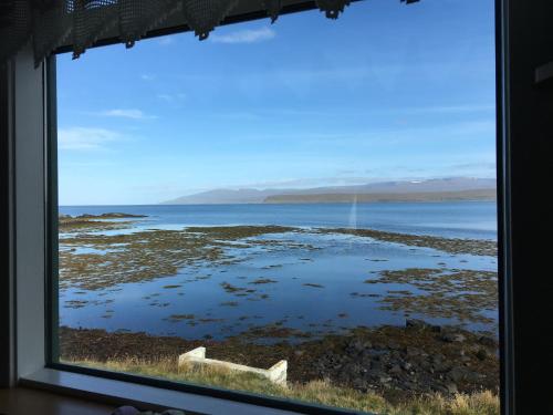 a view of the ocean from a window at Borgir - The House by the Sea in Borgir
