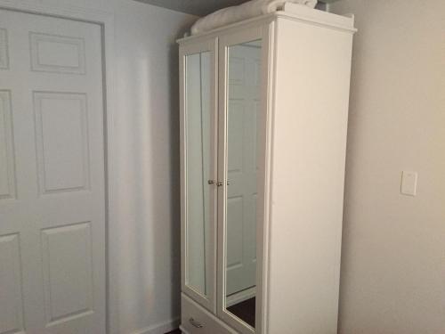 a white cabinet in the corner of a room at Catalina Island Seacrest Inn in Avalon