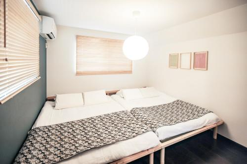a bedroom with a large bed in a room at こだま屋 in Tokyo