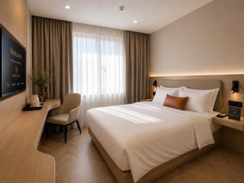 a hotel room with a large bed and a chair at Kentavr Hotel in Ulaanbaatar