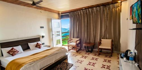a bedroom with a bed and a large window at Salberry Hotel in Lansdowne