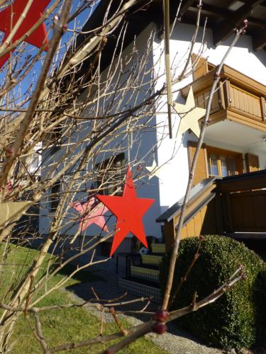 a red star on the side of a house at Haus Rosi in Uttendorf