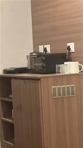 a fax machine sitting on top of a desk at Luxura stays in Greater Noida