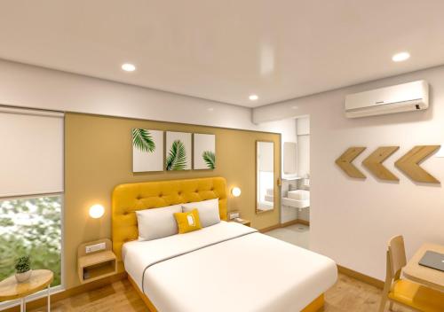 a bedroom with a large bed and a bathroom at Bloom Hotel CMH Road Indiranagar in Bangalore