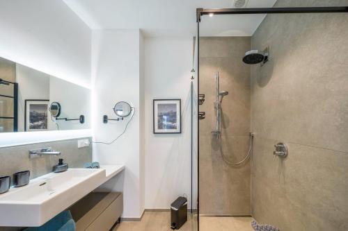 a bathroom with a sink and a shower at Apartment Nest 20 in Ettenheim