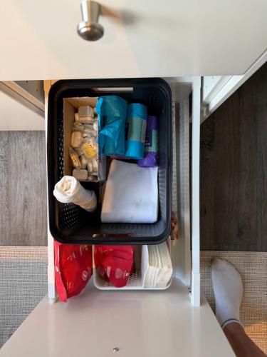 an open refrigerator filled with items in a room at Central Studio apartment in Notodden