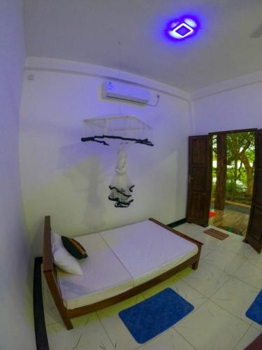 a bedroom with a bed in a room at Lake View Eco Lodge in Dambulla