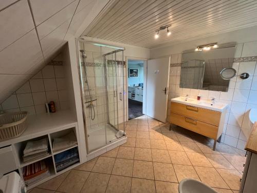 a bathroom with a shower and a sink at Lüly in Lütjensee