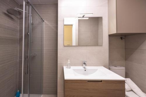 a bathroom with a sink and a shower at Apartamento Nova by Cartagena Spain in Cartagena