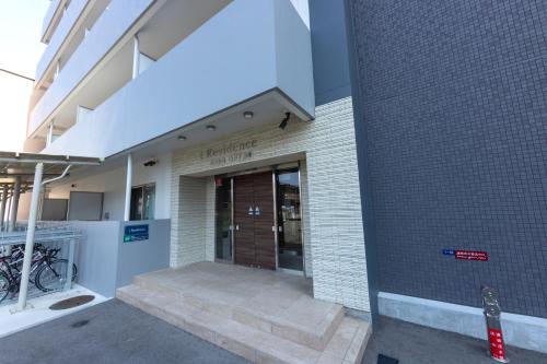 a building with a entrance to a building at Tomattoco KASUMI in Yamagata