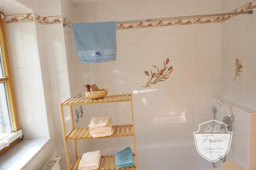 a bathroom with a shower with a towel rack at Ferienwohnungen Schönwetter Oberpfaffenhofen in Weßling