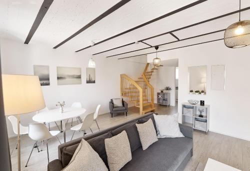 a living room with a couch and a table at Kenzingen Appartements zur Alten Brauerei in Kenzingen