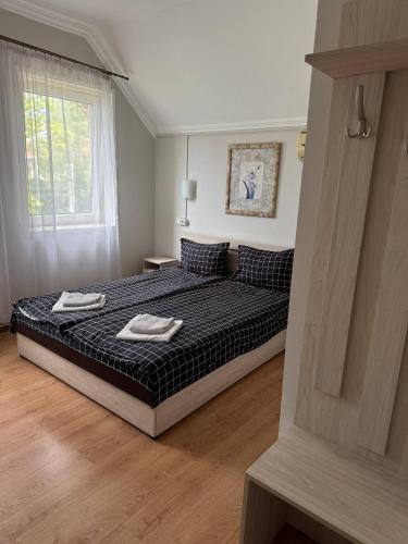 Postel nebo postele na pokoji v ubytování Centrum Hotel