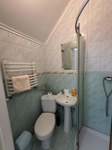 Koupelna v ubytování Centrum Hotel