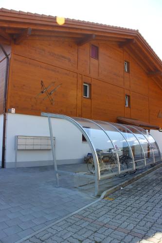 a building with a metal ramp in front of it at Jungfrau Penthouse - Aare Jungfrau AG in Wilderswil