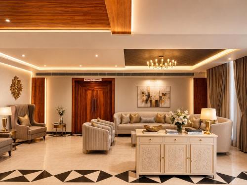 a living room with a couch and a table at Sterling Pushkar in Pushkar