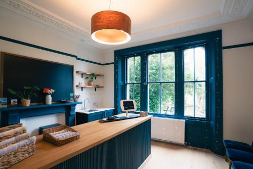 an office with a desk and a large window at Base Camp Hathersage, YHA Partner in Hathersage