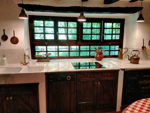 a kitchen with a sink and a window at Casa rural Garata in Arantza