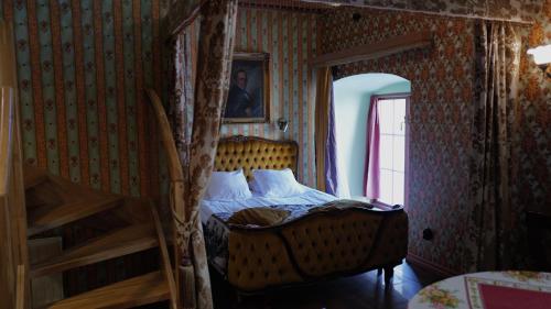 a bedroom with a bunk bed and a ladder at Börsen Apartment Suites in Visby
