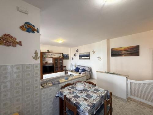 a room with a table and a table and a room with a tableablish at Fiore's house in Porto Santo Stefano