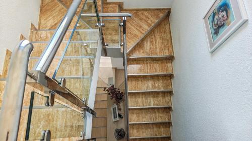 a spiral staircase in a house with wooden floors at Casa Las Vistas in Bolnuevo