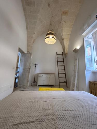 a bedroom with a large bed in a room with a window at DimoraStella in Pezze di Greco