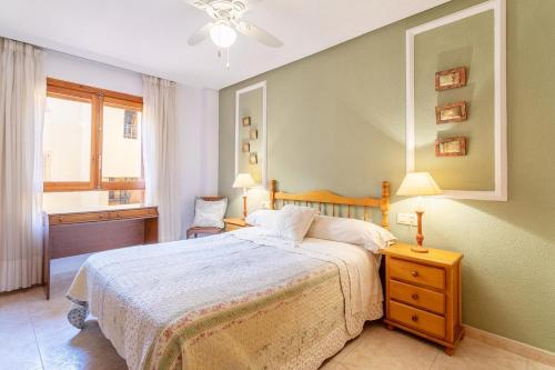 a bedroom with a large bed and a window at Spacious apartment with sea view in La Mata - 75 m² - Pool in La Mata