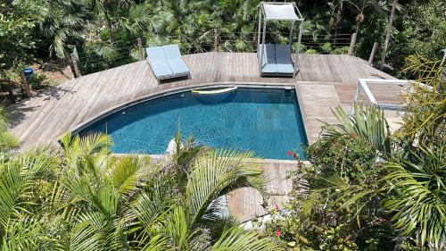 a swimming pool with two lounge chairs at Heavenly Villa in Gustavia with Private Pool in Gustavia