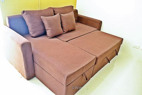 En eller flere senge i et værelse på Wind Residences For Rent - Luiice