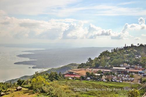 a view of the ocean from a mountain at Wind Residences For Rent - Luiice in Tagaytay