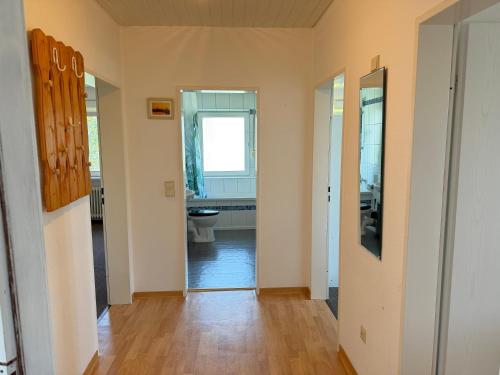 a hallway with a toilet in a room at Steilsand 1 - 200 M Zum Strand in Cuxhaven