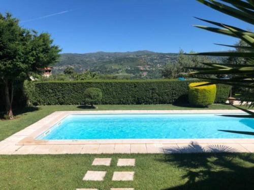 a swimming pool in the middle of a yard at Charming Villa in Resende with Private Pool in Resende