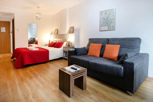 a living room with a couch and a bed at Modern studio in Arinsal of 40 m² with mountain view in Arinsal