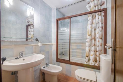 a bathroom with a sink and a toilet at Inmacanela playa in Isla Canela
