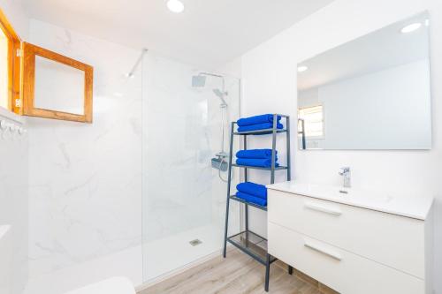 a bathroom with a shower and a sink and a mirror at PDM CA'N NOFRE in Playa de Muro