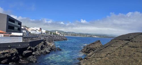 a body of water next to some rocks at GuestReady - Sea Apartments in São Roque