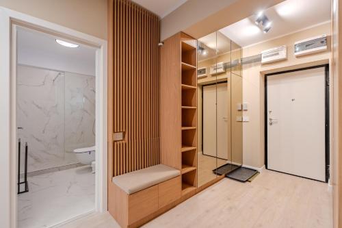 a bathroom with a toilet and a walk in shower at Own the Moment by Blvd 41B7 - Free Parking in Voluntari