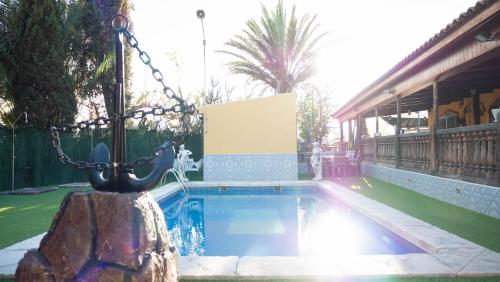 a swimming pool in front of a house at Elegant Villa in Archena + Private Pool in Archena