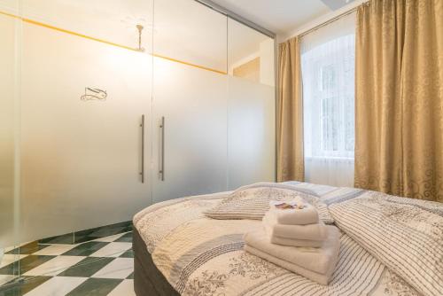 a bedroom with a bed with towels on it at Comfortable apartment in Bad Schandau – 55 m² with garden terrace in Bad Schandau